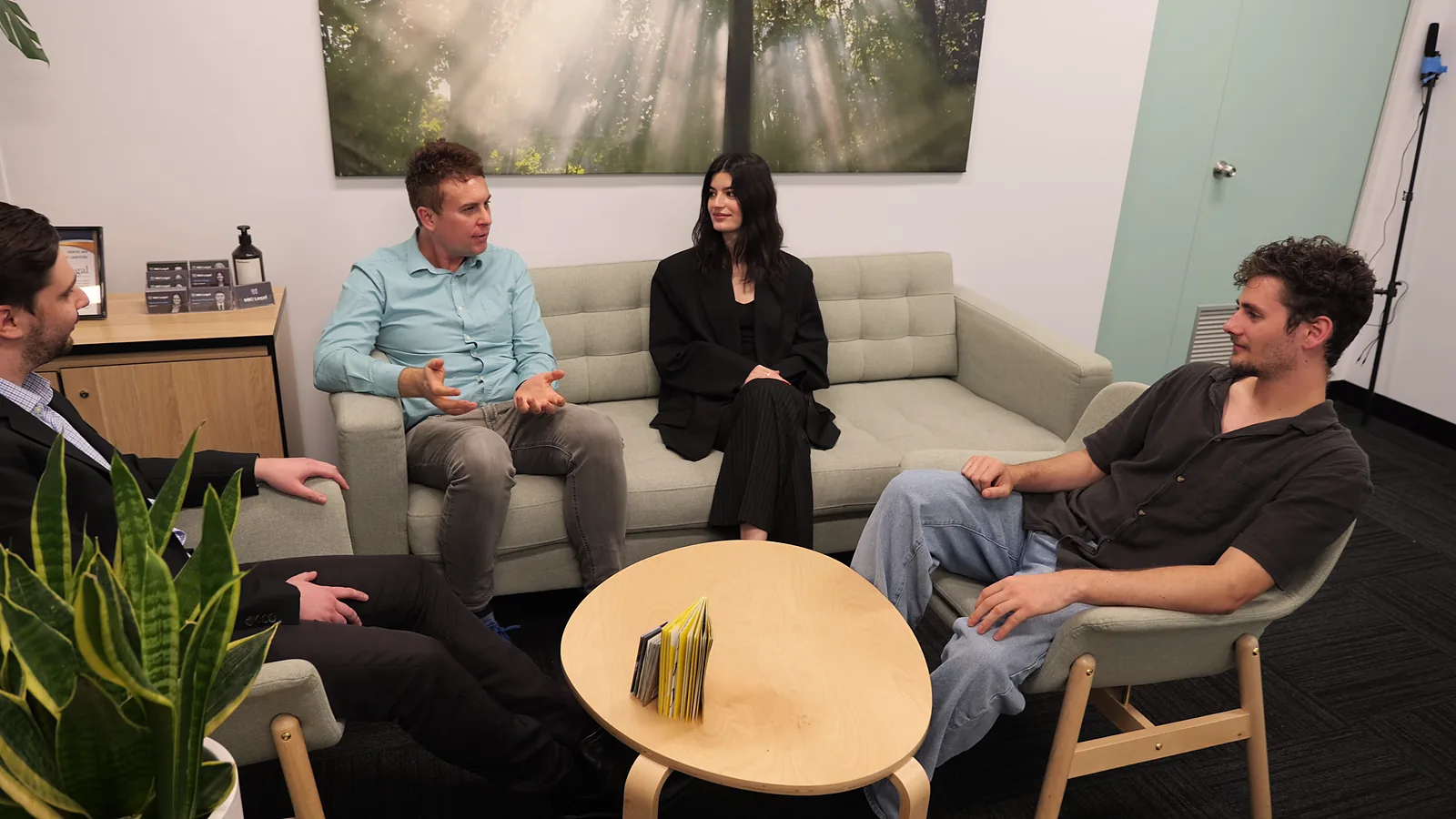 The Lawcaptain team talking together in the office